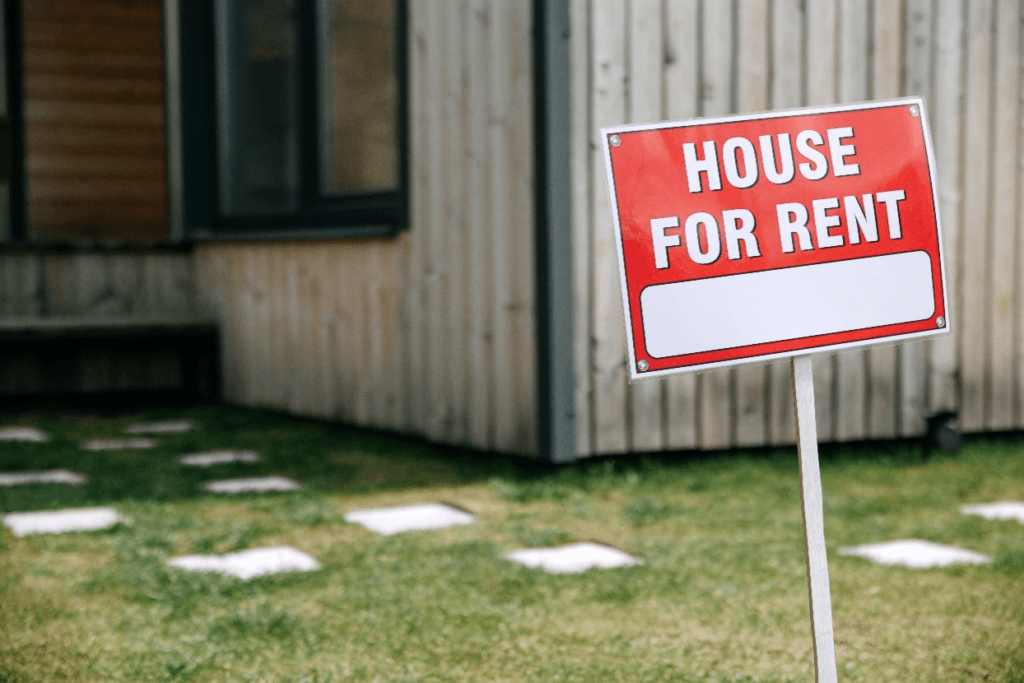 A sign board of House for rent in white color
