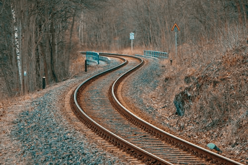 An Empty, Snaking Railway Track Framed bytheWoods