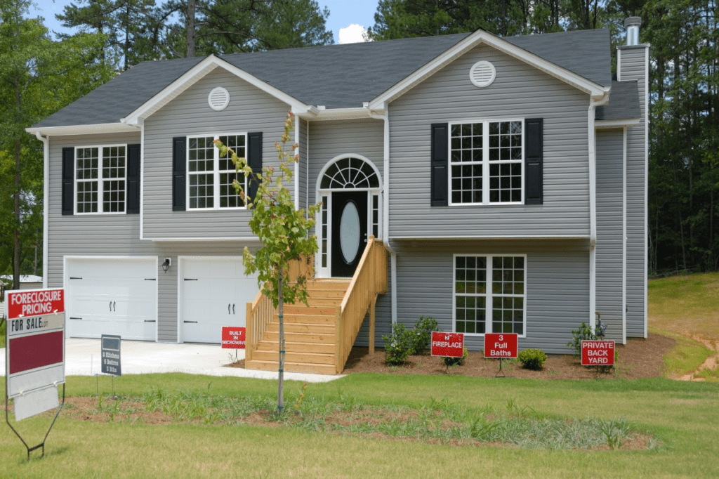 A Detached Two-Story Foreclosure Property with a ‘For Sale’ Sign