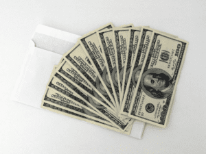dollar bills with an envelope