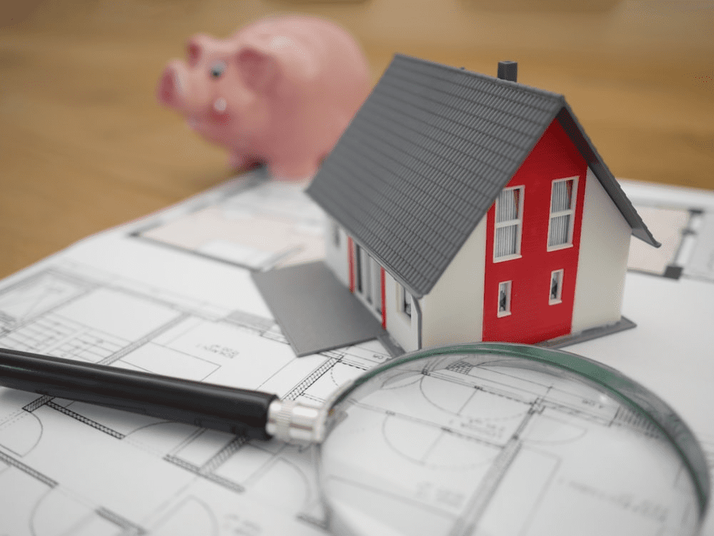 house-piggy-bank-magnifying-glass