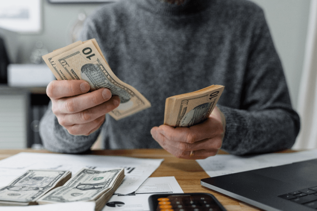 Close up shot of a man counting money