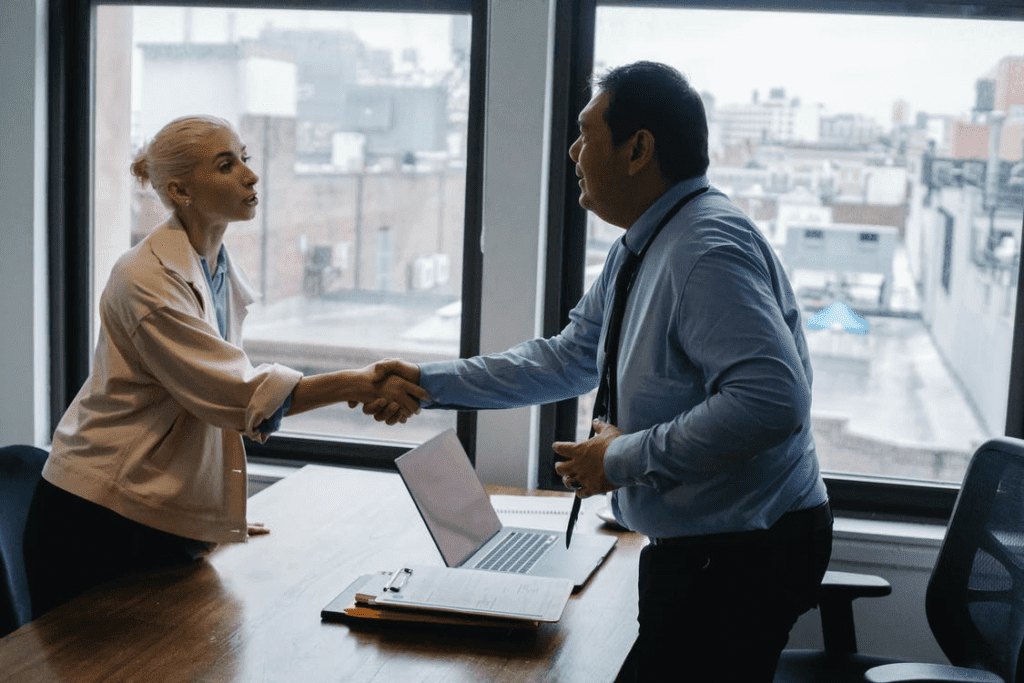 A private lender shaking his hand with the client