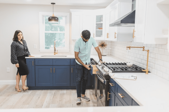 An individual inspecting a kitchen