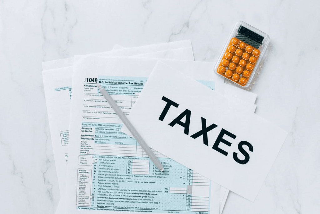 A US individual income tax return form and a calculator