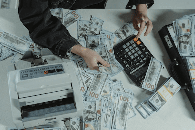 A private lender counting dollar bills