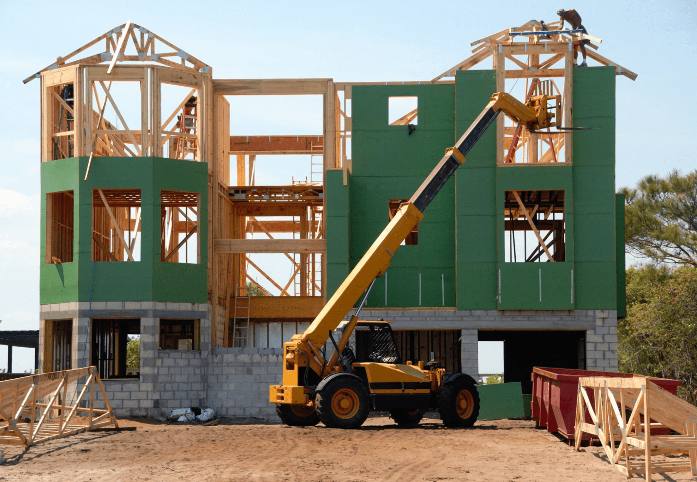  A photo showing a crane next to a property under construction.