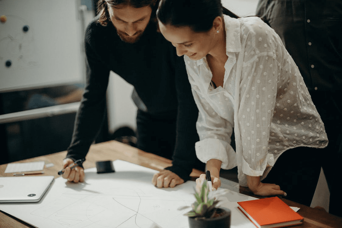 Two people discussing a new construction plan