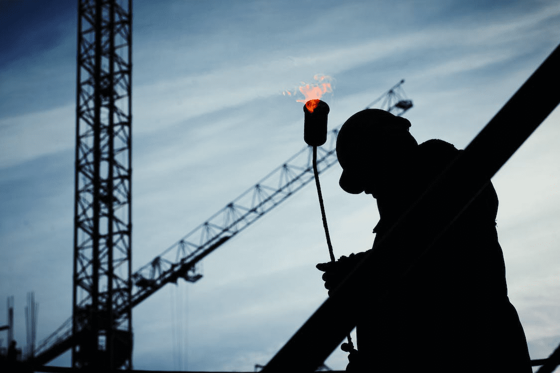 Silhouette of a worker at a new construction site