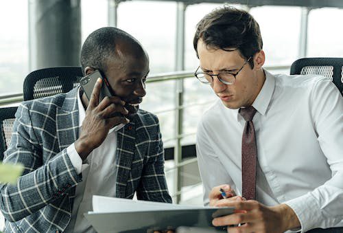 Two people discussing new construction loan terms