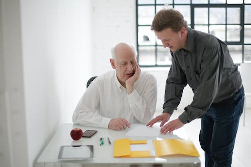 A person reviewing paperwork for a new construction loan. 