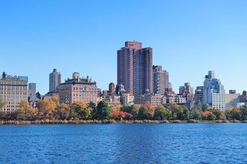 City skyline viewed across a body of water on a clear day.