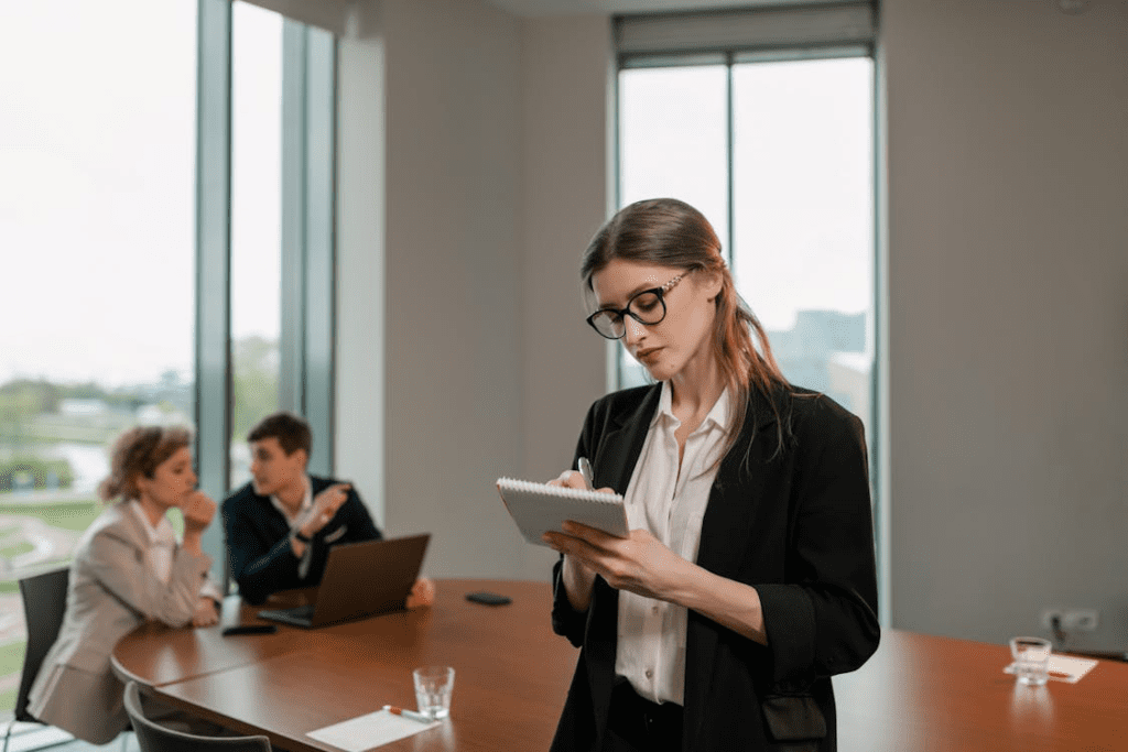 Hard money lender with clients in conference room