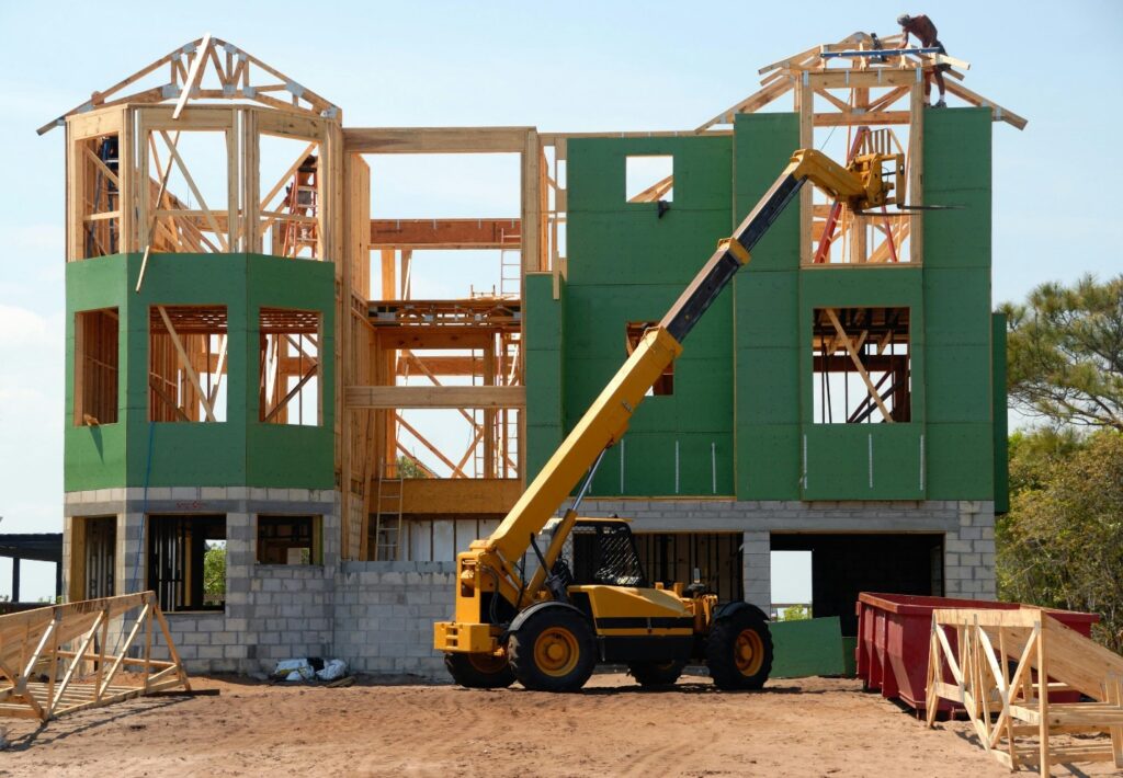 building a house with a green exterior