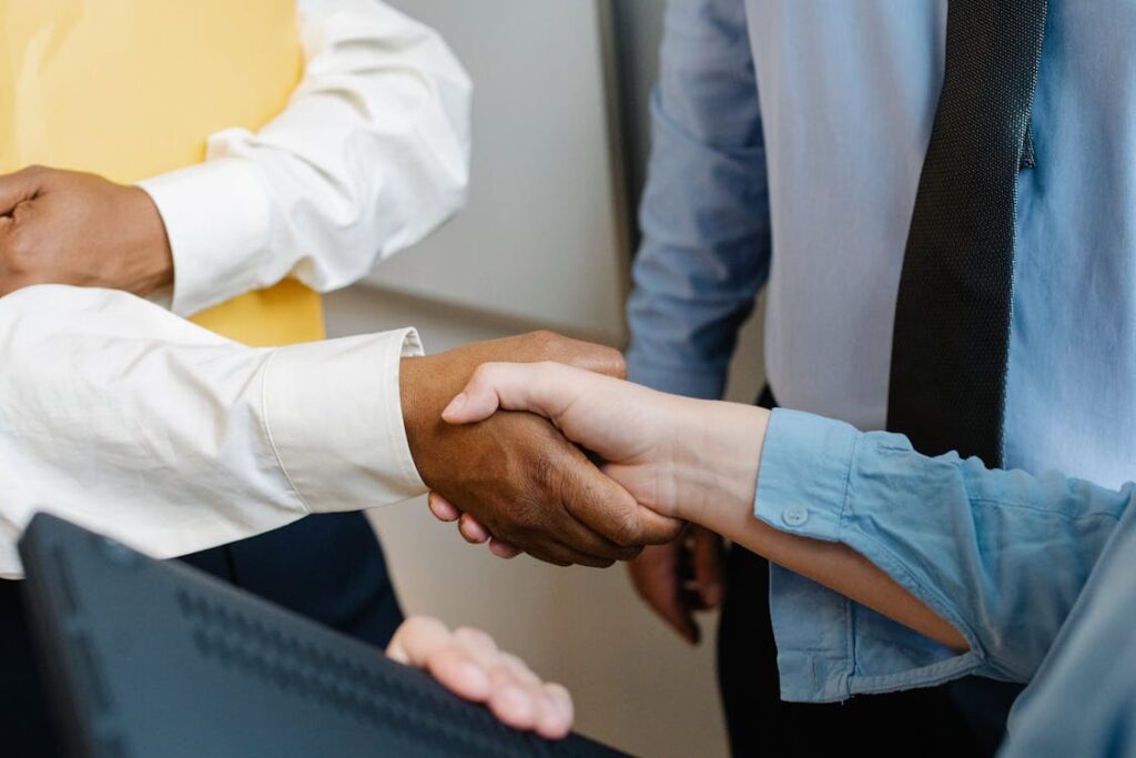 A person shaking hands with a lender