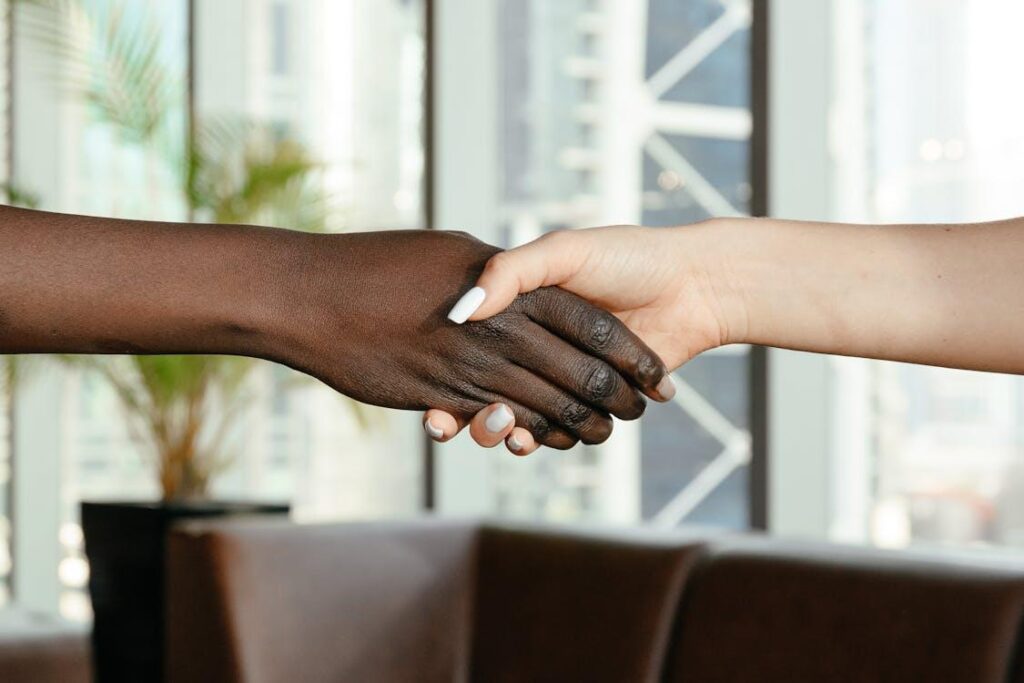 Two people shaking hands to create reputation. 