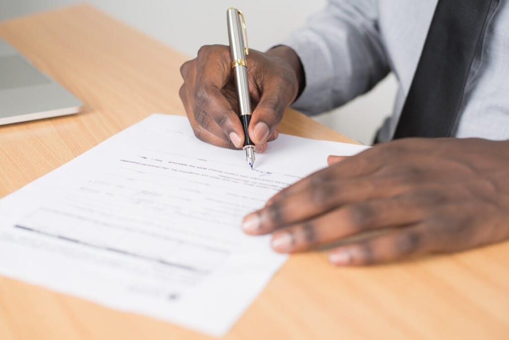 A person signing legal paperwork.