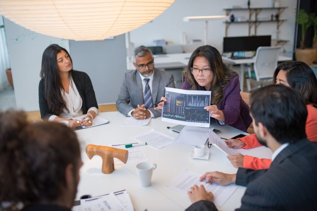 A large meeting being held in the office.