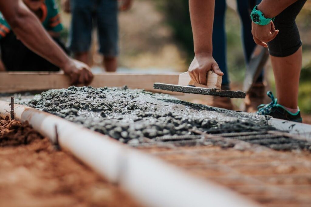 Workers laying cement