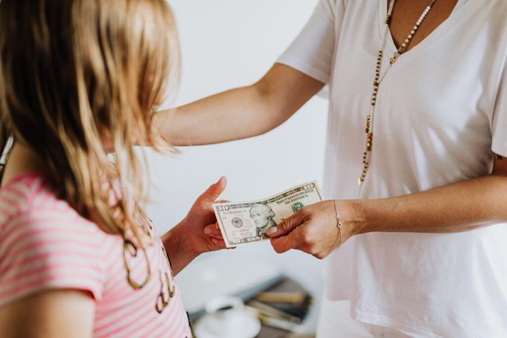 A person handing out money to another person.