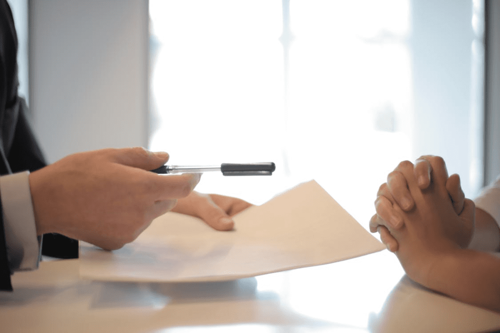 an individual handing over a document