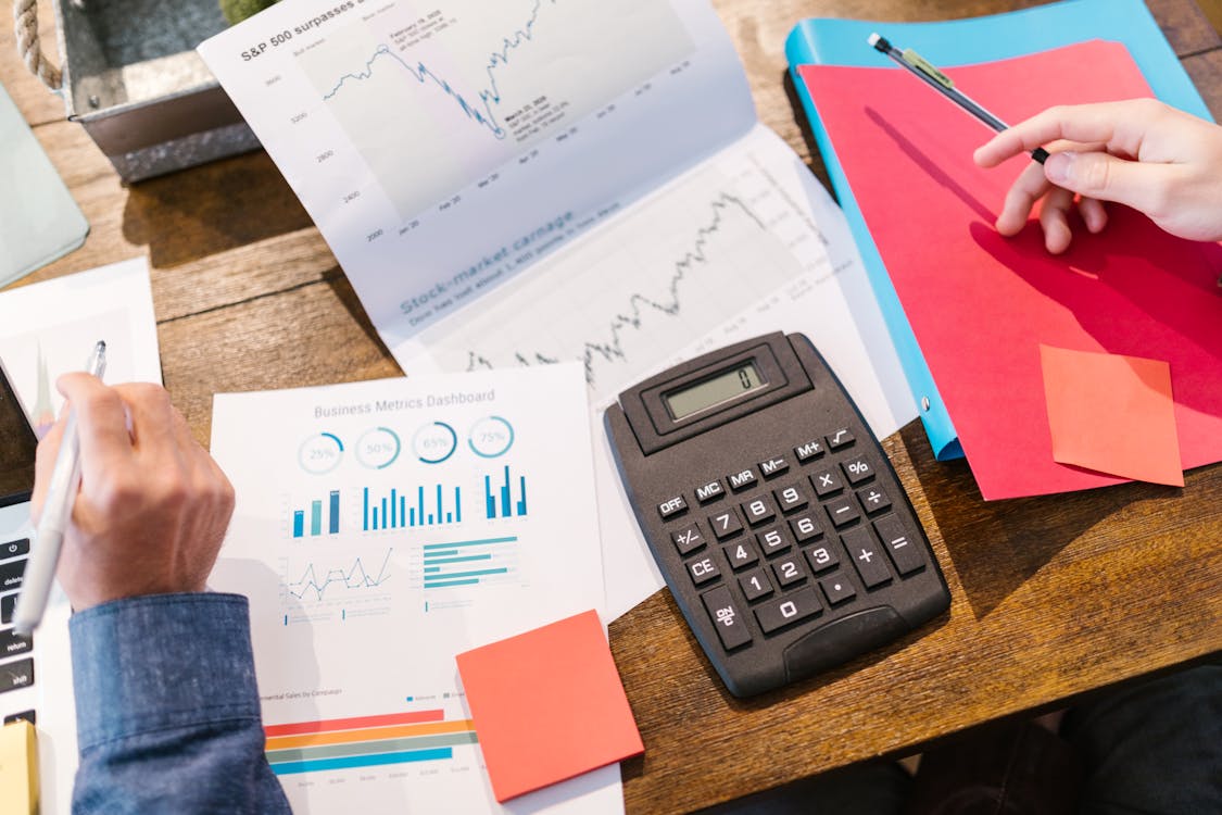 A person sitting and calculating loan options