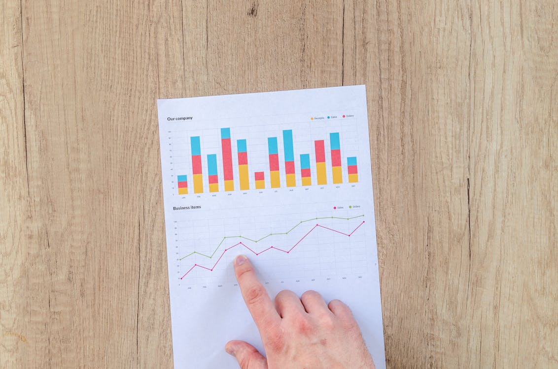 A person looking at statistics on a piece of paper