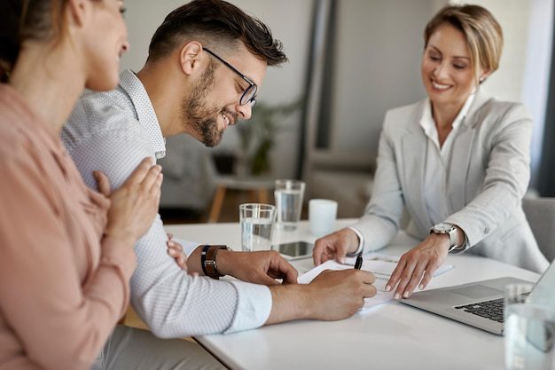 expert helping a couple with documents for portfolio financing