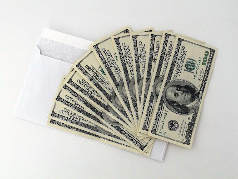 a stack of 100 U.S. dollar banknotes, symbolizing financial resources and investment opportunities