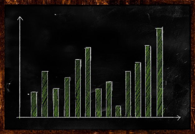 Investor reviewing positive cash flow graphs on financial documents