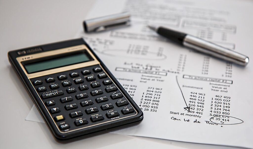 Close-up of a calculator on a paper with real estate financing calculations.