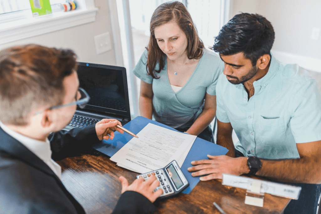 A couple discussing loan options with an agent