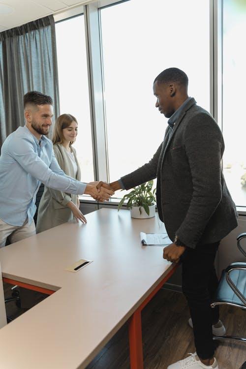 individuals shaking hands