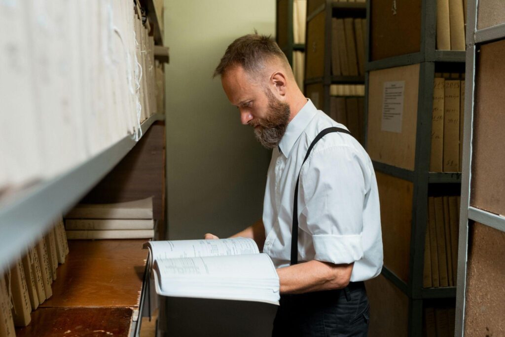 Investor examining property files, symbolizing clear and rapid hard money lending decisions.