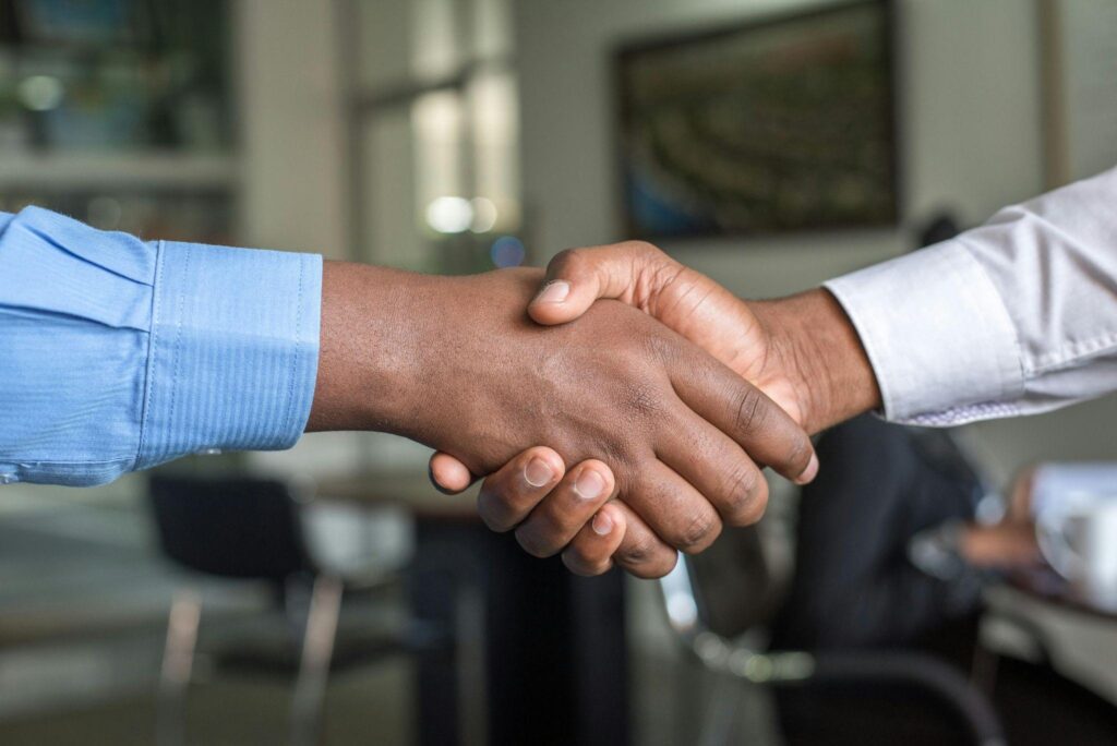 Close-up handshake representing strong, transparent relationships in private lending solutions.