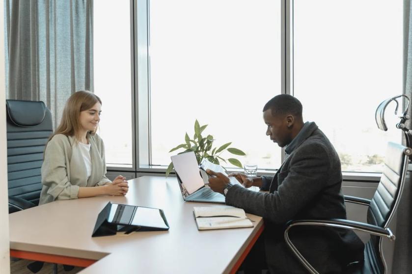 An image of a woman and a man in an office