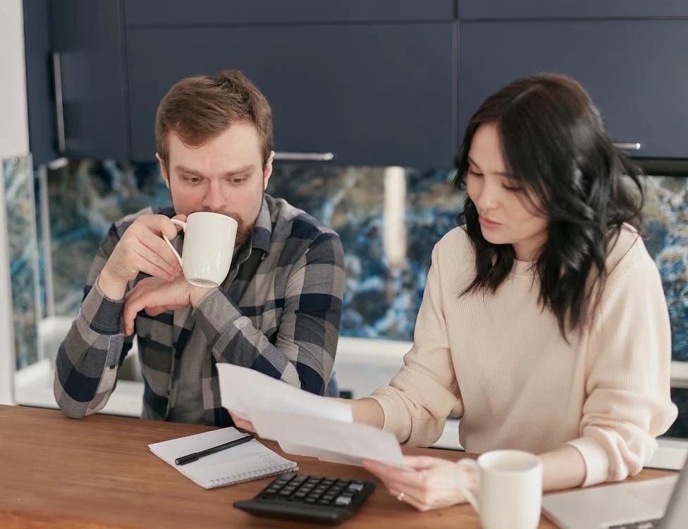 two people looking at documents