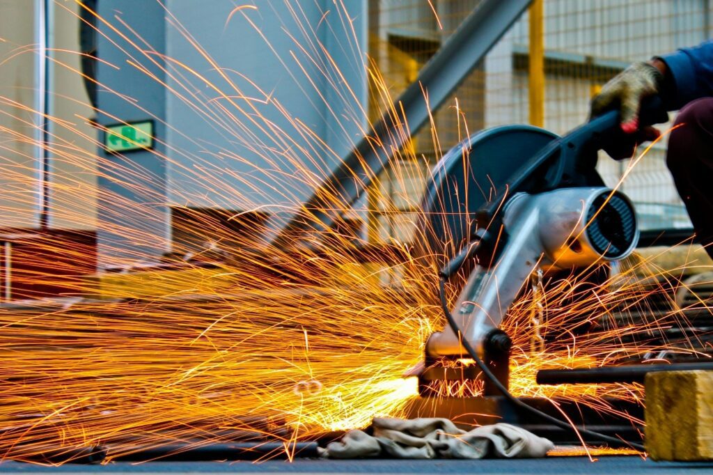 Construction worker using a saw machine