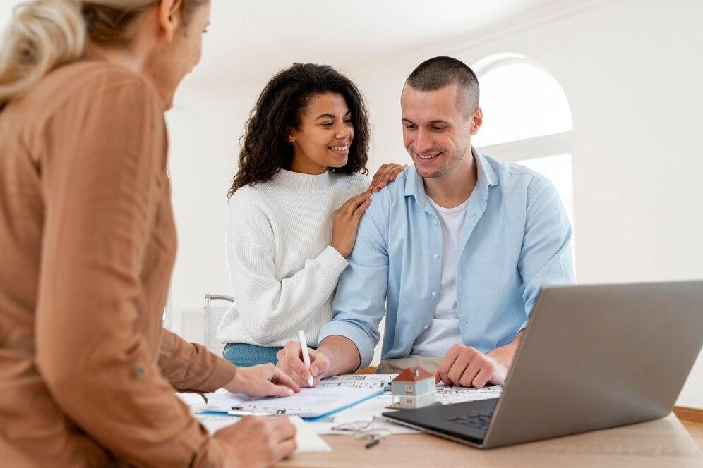 A couple signing a form