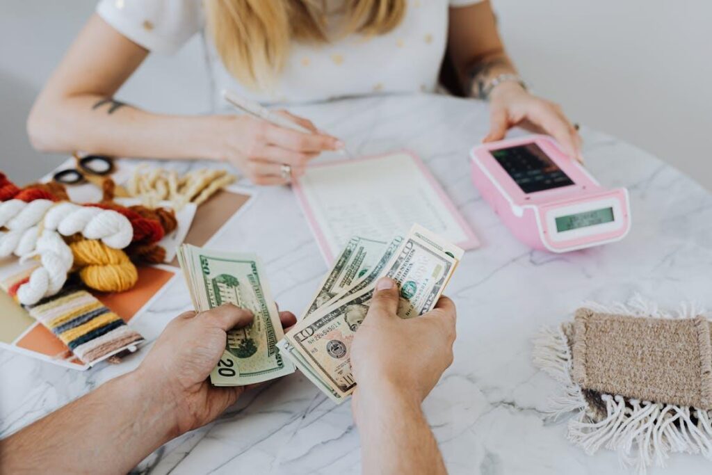Two people counting cash