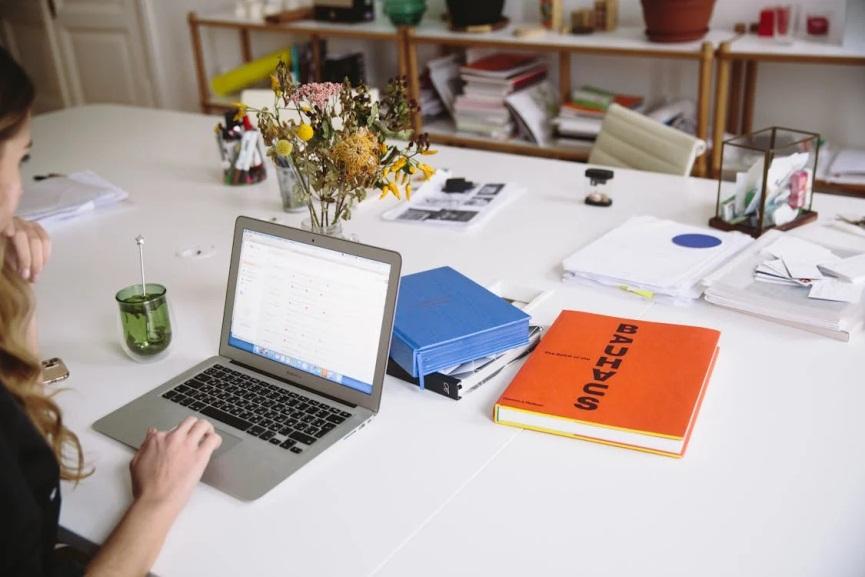 An image of a woman using her laptop