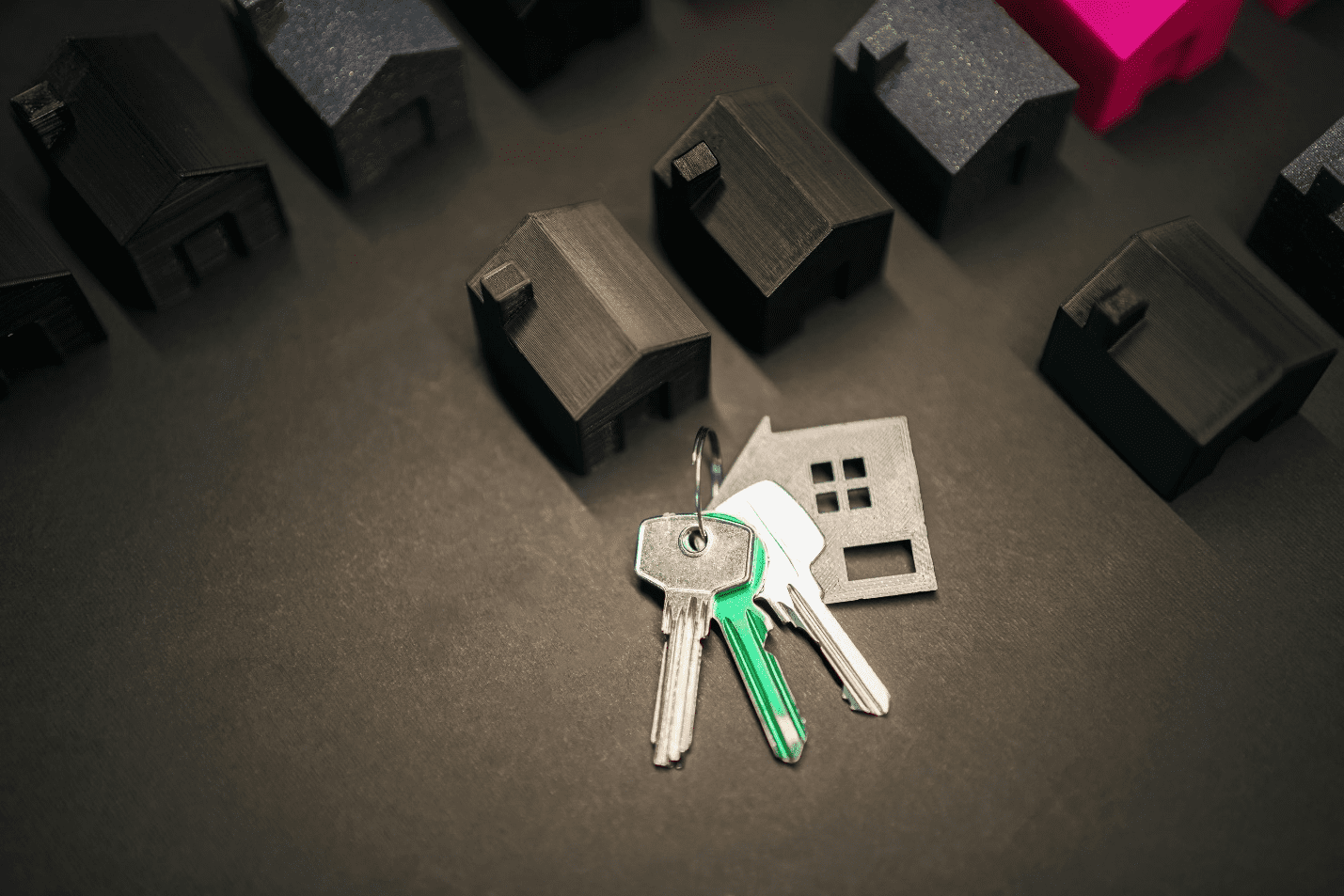 A picture of house models and keys