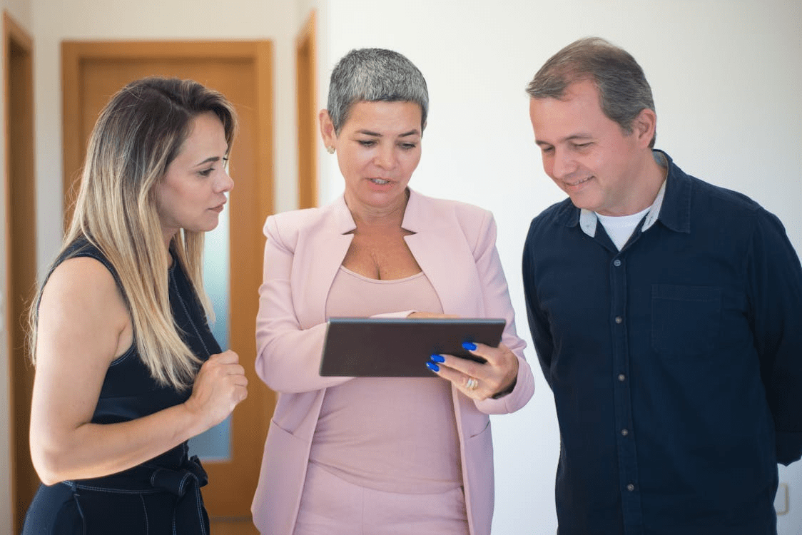 a couple consulting an agent.