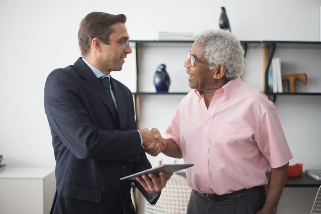 A loan agent shaking a client's hand