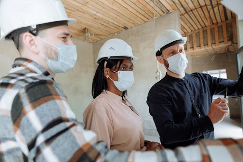 Three experts at a property under construction