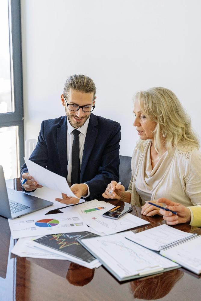 Real estate investors reviewing documents and discussing plans for build-to-rent developments