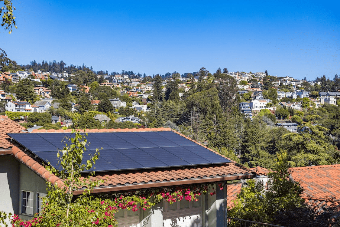 A raised beach house with hurricane-resistant windows and solar panels