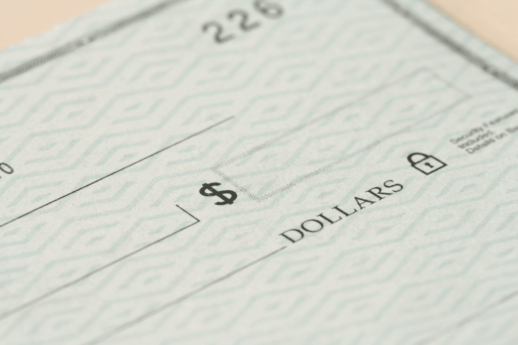 Cheque symbolizing funding for hard money borrowing in real estate.