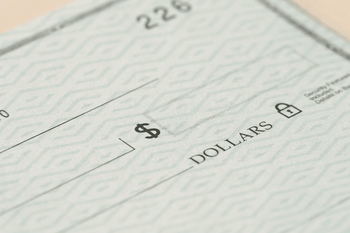 Cheque symbolizing funding for hard money borrowing in real estate.