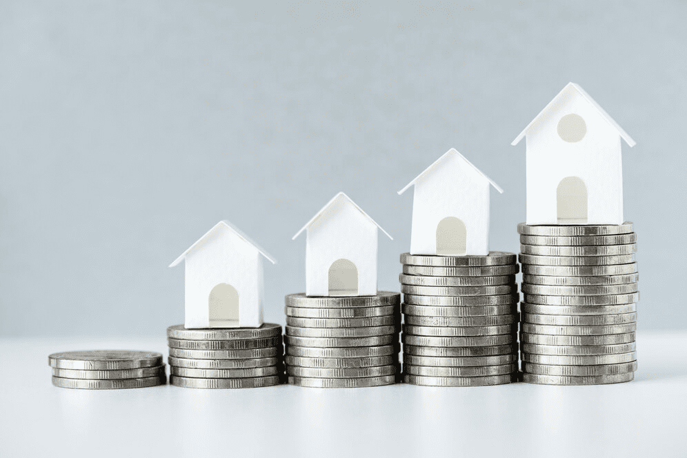 Coins stacked with houses on top